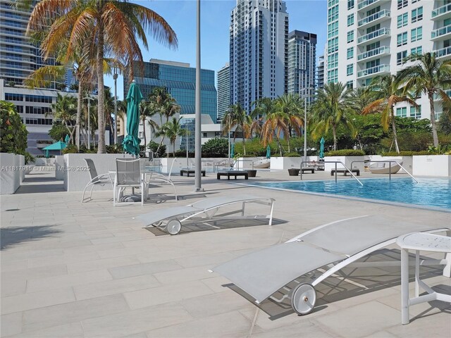 950 Brickell Bay Dr Unit 1608, Miami, FL 33131 - community pool with a city view and a patio
