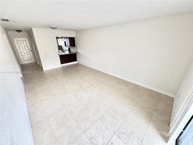 6121 W 24th Ave Unit 204, Hialeah, FL 33016 - empty room with light tile patterned floors and baseboards
