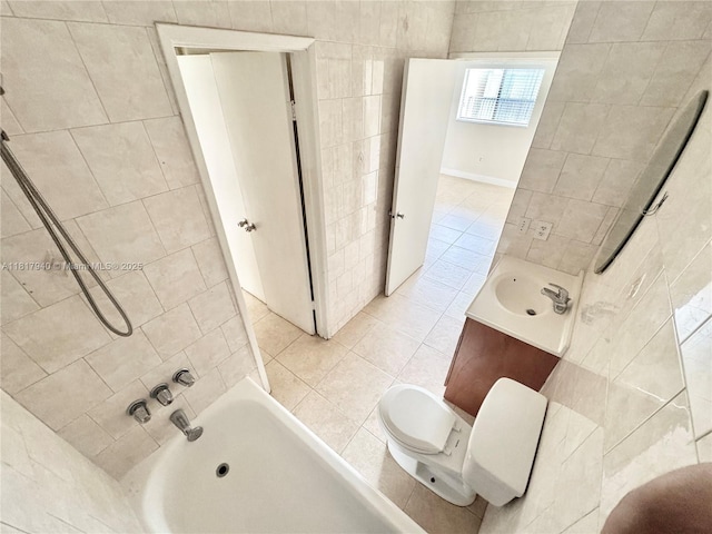 6121 W 24th Ave Unit 204, Hialeah, FL 33016 - bathroom with tile walls, vanity, toilet, tile patterned floors, and washtub / shower combination