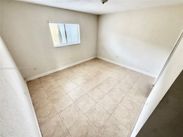 6121 W 24th Ave Unit 204, Hialeah, FL 33016 - unfurnished room with light tile patterned floors and baseboards
