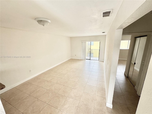 6121 W 24th Ave Unit 204, Hialeah, FL 33016 - spare room with light tile patterned floors and baseboards