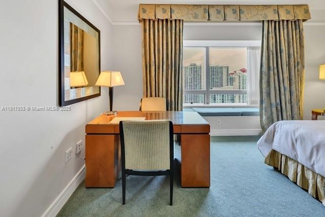 1435 Brickell Ave Unit 3011, Miami, FL 33131 - carpeted bedroom with baseboards and a desk