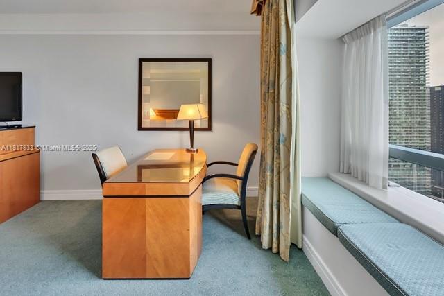1435 Brickell Ave Unit 3011, Miami, FL 33131 - carpeted home office with baseboards, plenty of natural light, and crown molding