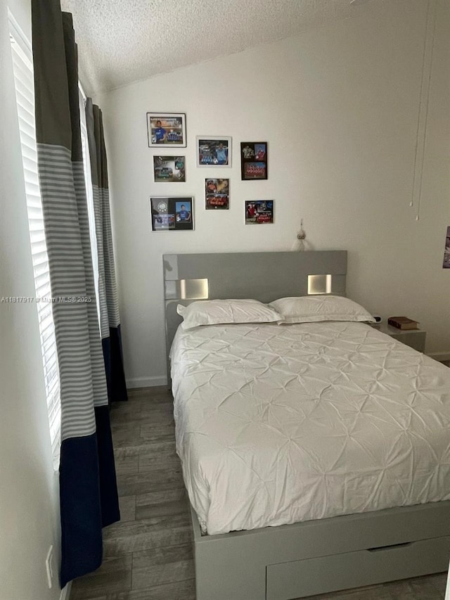 10803 Cypress Glen Dr Unit 10803, Coral Springs, FL 33071 - bedroom with vaulted ceiling, a textured ceiling, and dark wood-type flooring