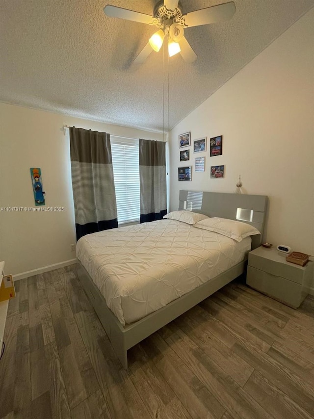 10803 Cypress Glen Dr Unit 10803, Coral Springs, FL 33071 - bedroom with a textured ceiling, wood finished floors, lofted ceiling, a ceiling fan, and baseboards