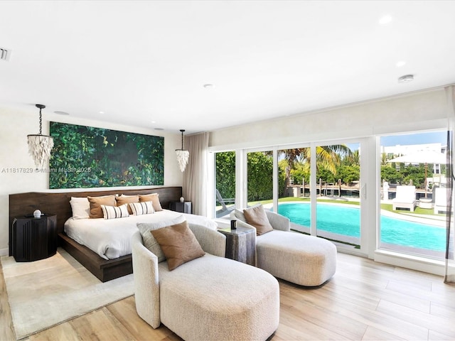 2371 Bayview Ln, North Miami, FL 33181 - bedroom with access to exterior, light wood finished floors, and recessed lighting