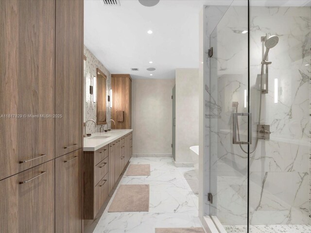 2371 Bayview Ln, North Miami, FL 33181 - full bathroom featuring a marble finish shower, double vanity, a freestanding tub, marble finish flooring, and recessed lighting