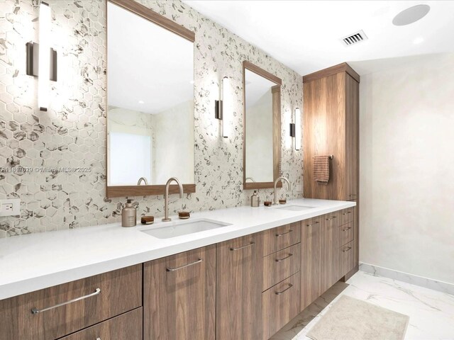 2371 Bayview Ln, North Miami, FL 33181 - full bathroom with double vanity, baseboards, and marble look tile flooring