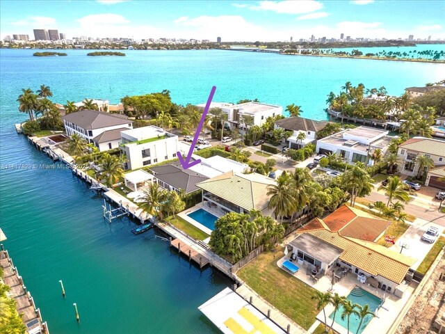 2371 Bayview Ln, North Miami, FL 33181 - aerial perspective of suburban area with a large body of water and city skyline