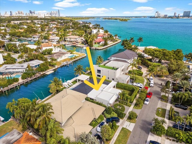 2371 Bayview Ln, North Miami, FL 33181 - aerial perspective of suburban area with a large body of water and skyline