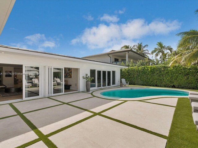 2371 Bayview Ln, North Miami, FL 33181 - view of swimming pool with a patio area