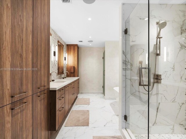 2371 Bayview Ln, North Miami, FL 33181 - full bath with a marble finish shower, double vanity, a freestanding tub, marble tiled floors, and recessed lighting