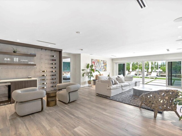 2371 Bayview Ln, North Miami, FL 33181 - living room with a dry bar, wood finished floors, and recessed lighting
