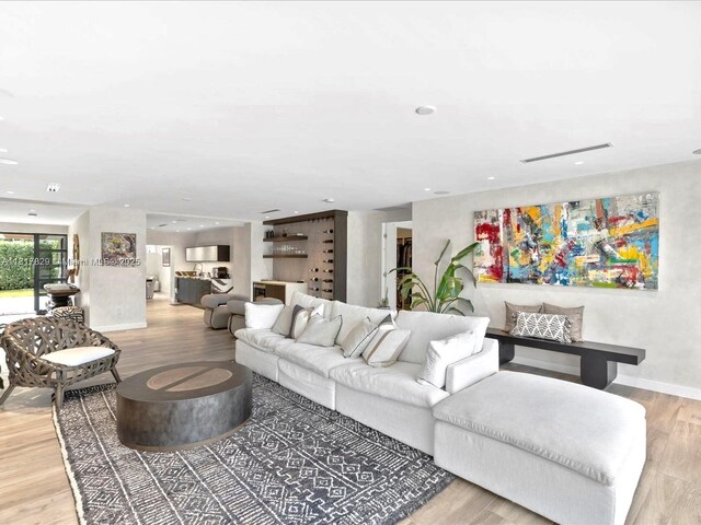 2371 Bayview Ln, North Miami, FL 33181 - living area featuring wood finished floors, baseboards, and recessed lighting