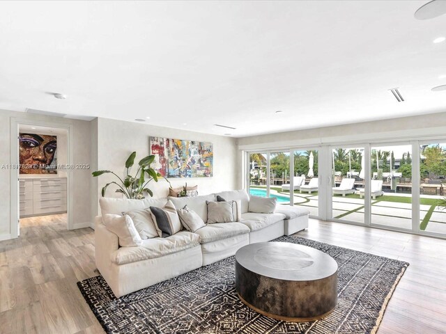 2371 Bayview Ln, North Miami, FL 33181 - living room featuring light wood-style floors, baseboards, and recessed lighting