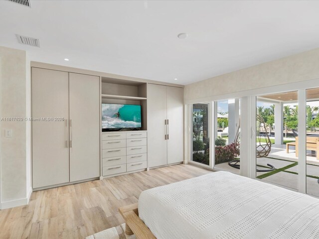 2371 Bayview Ln, North Miami, FL 33181 - bedroom featuring access to outside, multiple windows, light wood-style floors, and recessed lighting