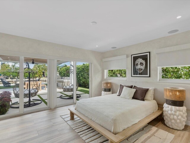 2371 Bayview Ln, North Miami, FL 33181 - bedroom with access to exterior, light wood-type flooring, and recessed lighting