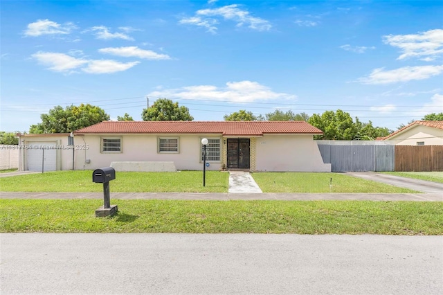 10845 SW 26th Ter, Miami, FL 33165 - single story home with stucco siding, a tile roof, and driveway