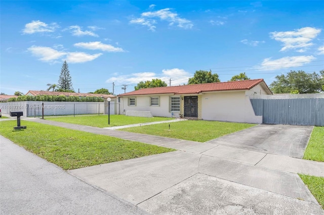 10845 SW 26th Ter, Miami, FL 33165 - ranch-style home with stucco siding, driveway, and a gate