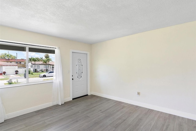 6221 NW 37th Ter, Virginia Gardens, FL 33166 - foyer entrance featuring wood finished floors and a textured ceiling