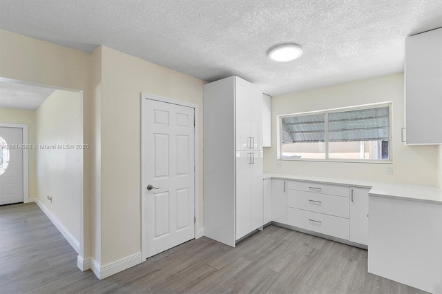 6221 NW 37th Ter, Virginia Gardens, FL 33166 - entryway with light wood-style floors and a textured ceiling