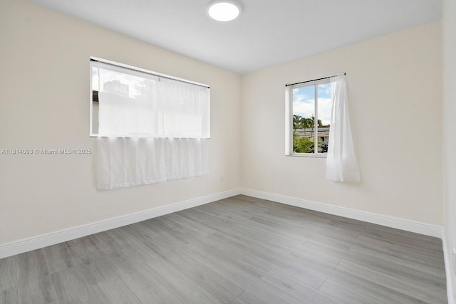 6221 NW 37th Ter, Virginia Gardens, FL 33166 - empty room with wood finished floors and baseboards