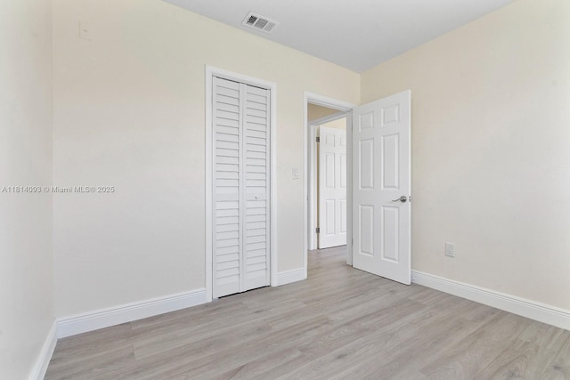 6221 NW 37th Ter, Virginia Gardens, FL 33166 - unfurnished bedroom with wood finished floors and a closet