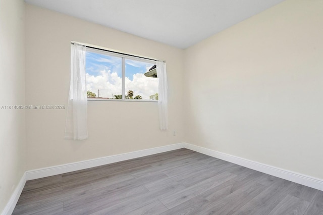 6221 NW 37th Ter, Virginia Gardens, FL 33166 - empty room with wood finished floors and baseboards