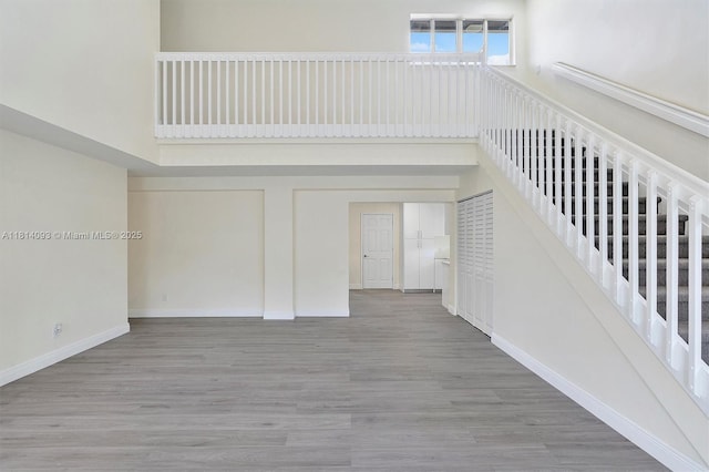 6221 NW 37th Ter, Virginia Gardens, FL 33166 - staircase with wood finished floors and a high ceiling