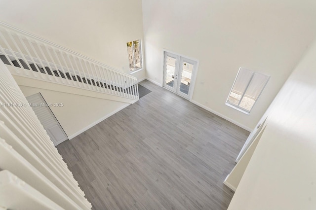 6221 NW 37th Ter, Virginia Gardens, FL 33166 - unfurnished living room with french doors, wood finished floors, and a high ceiling