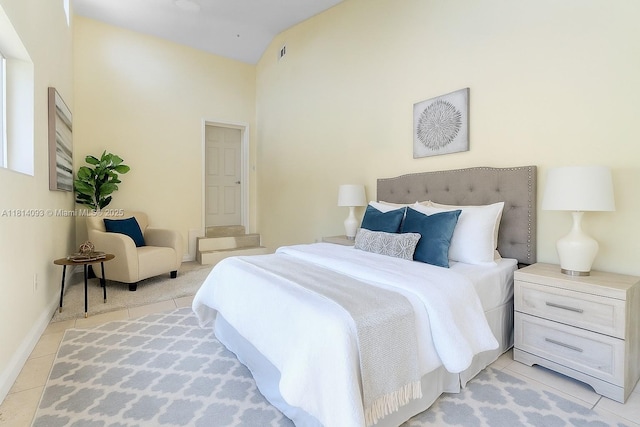 6221 NW 37th Ter, Virginia Gardens, FL 33166 - bedroom featuring light tile patterned flooring and vaulted ceiling