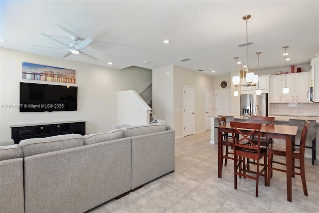 2200 Garden Belle Dr, Clermont, FL 34711 - living room featuring ceiling fan, recessed lighting, light tile patterned flooring, baseboards, and stairs