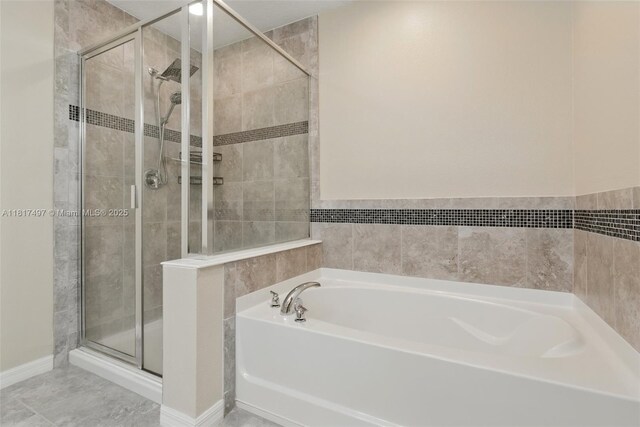 2200 Garden Belle Dr, Clermont, FL 34711 - bathroom with a bath and a stall shower