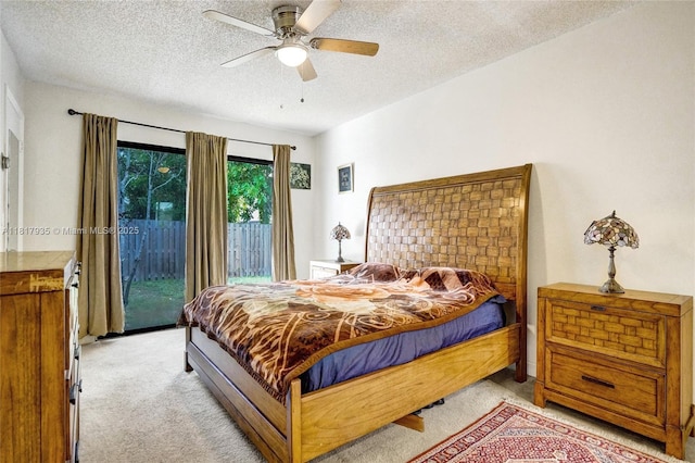 4459 NW 113th Ln, Coral Springs, FL 33065 - bedroom featuring light colored carpet, access to outside, a textured ceiling, and ceiling fan