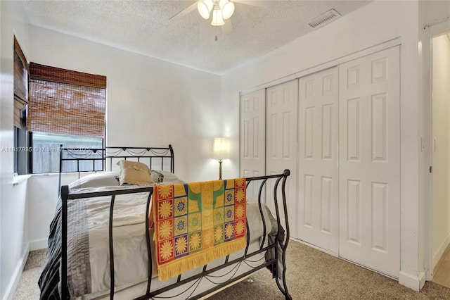 4459 NW 113th Ln, Coral Springs, FL 33065 - carpeted bedroom with a textured ceiling, a closet, a ceiling fan, and baseboards
