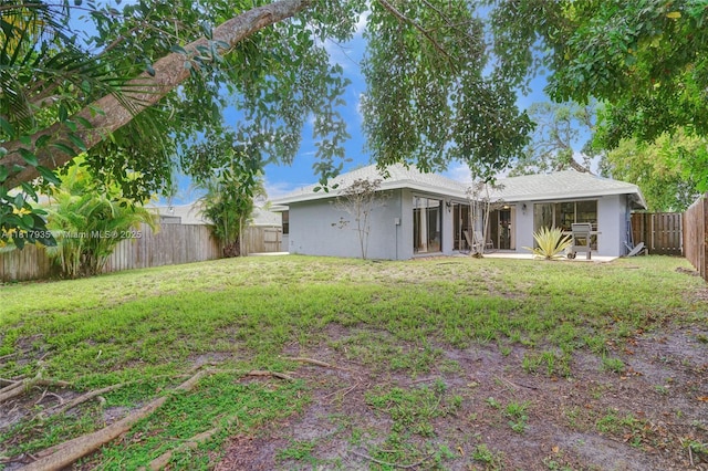 4459 NW 113th Ln, Coral Springs, FL 33065 - back of house with stucco siding and a patio area
