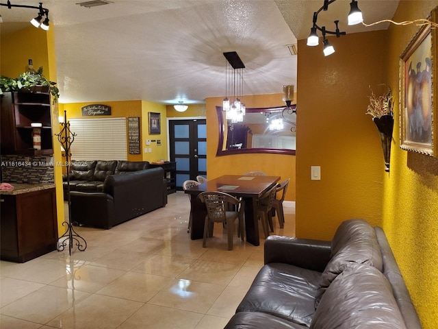 14880 SW 56th Ter, Miami, FL 33193 - living area featuring light tile patterned floors, french doors, and a textured ceiling