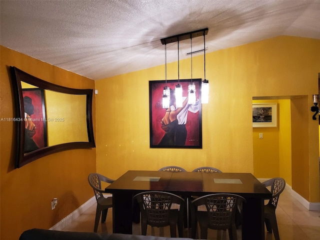 14880 SW 56th Ter, Miami, FL 33193 - dining room with lofted ceiling, a textured ceiling, and baseboards