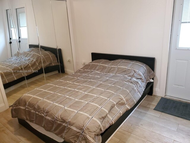 14880 SW 56th Ter, Miami, FL 33193 - bedroom featuring multiple windows and wood finished floors