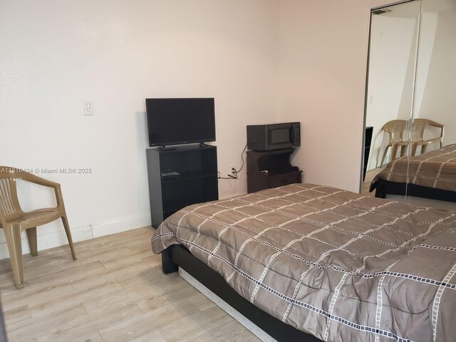 14880 SW 56th Ter, Miami, FL 33193 - bedroom featuring wood finished floors and baseboards
