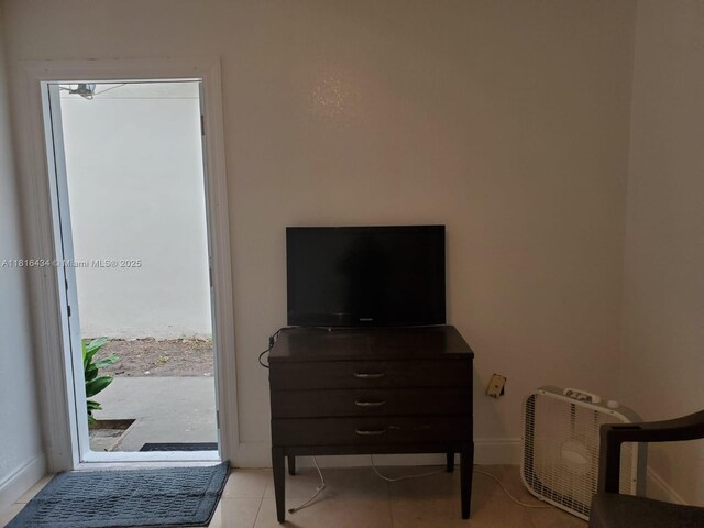 14880 SW 56th Ter, Miami, FL 33193 - bedroom with tile patterned flooring and baseboards
