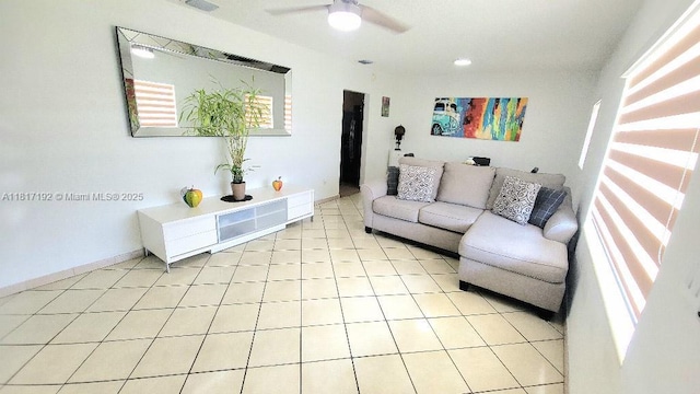 200 W 53rd Ter, Hialeah, FL 33012 - living room featuring a ceiling fan, light tile patterned floors, and baseboards