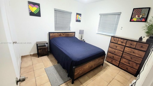 200 W 53rd Ter, Hialeah, FL 33012 - bedroom with light tile patterned floors and baseboards