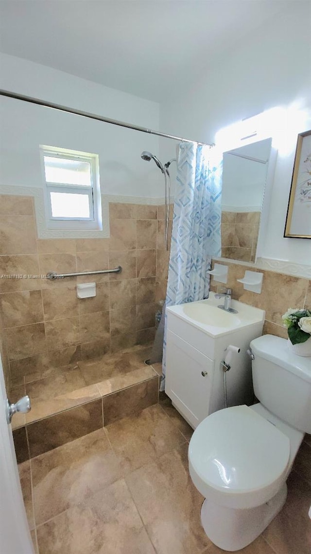200 W 53rd Ter, Hialeah, FL 33012 - bathroom with tiled shower, toilet, vanity, tile walls, and tile patterned floors