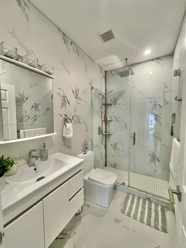 12453 SW 197th Ter, Miami, FL 33177 - full bath with a marble finish shower, vanity, marble finish floors, and toilet