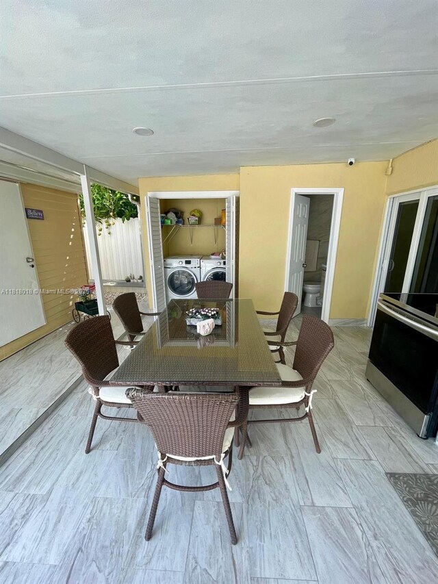 12453 SW 197th Ter, Miami, FL 33177 - deck with washer and clothes dryer and outdoor dining area