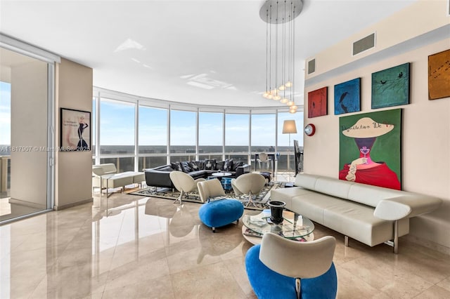 18101 Collins Ave Unit 5401, Sunny Isles Beach, FL 33160 - living area featuring floor to ceiling windows, plenty of natural light, and baseboards