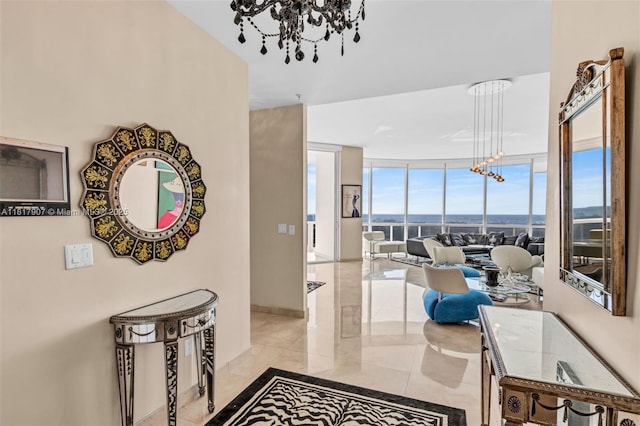 18101 Collins Ave Unit 5401, Sunny Isles Beach, FL 33160 - hall featuring a chandelier and a wall of windows