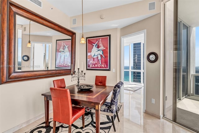 18101 Collins Ave Unit 5401, Sunny Isles Beach, FL 33160 - dining space featuring light tile patterned flooring and baseboards