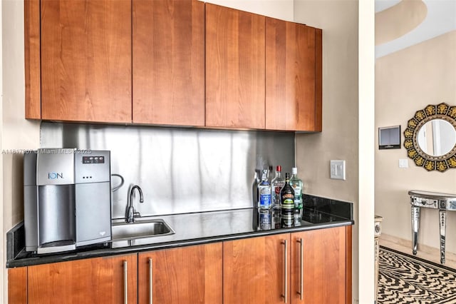 18101 Collins Ave Unit 5401, Sunny Isles Beach, FL 33160 - kitchen with a sink, brown cabinetry, dark countertops, and tasteful backsplash